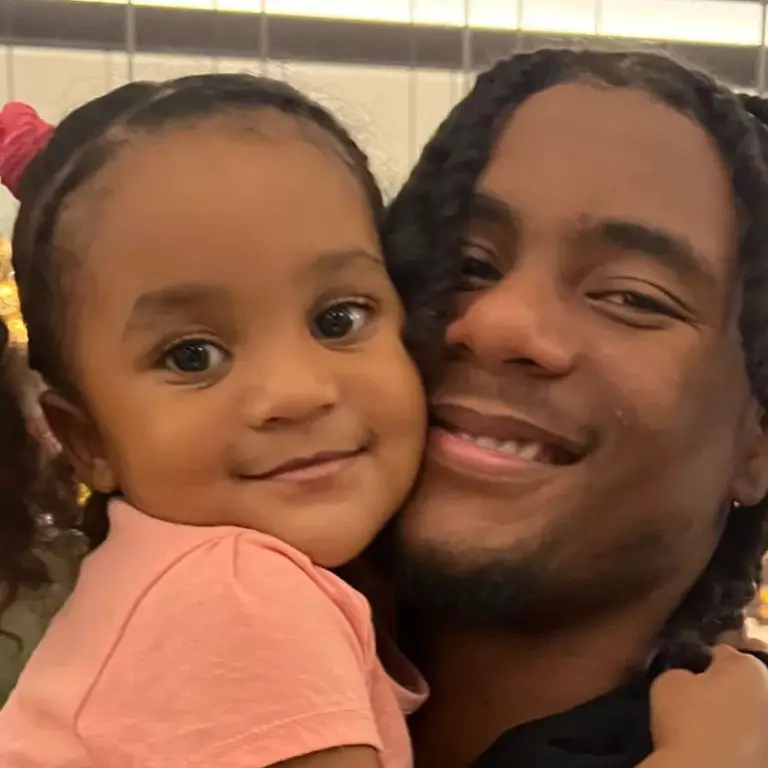 Adonai Mitchell with his daughter