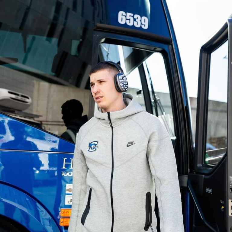 Baylor Scheierman Arriving For His Game listening music in a bus.