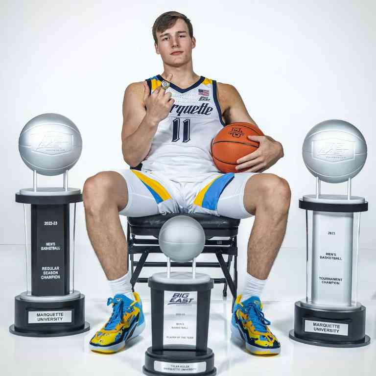 Tyler Kolek posing with his trophies