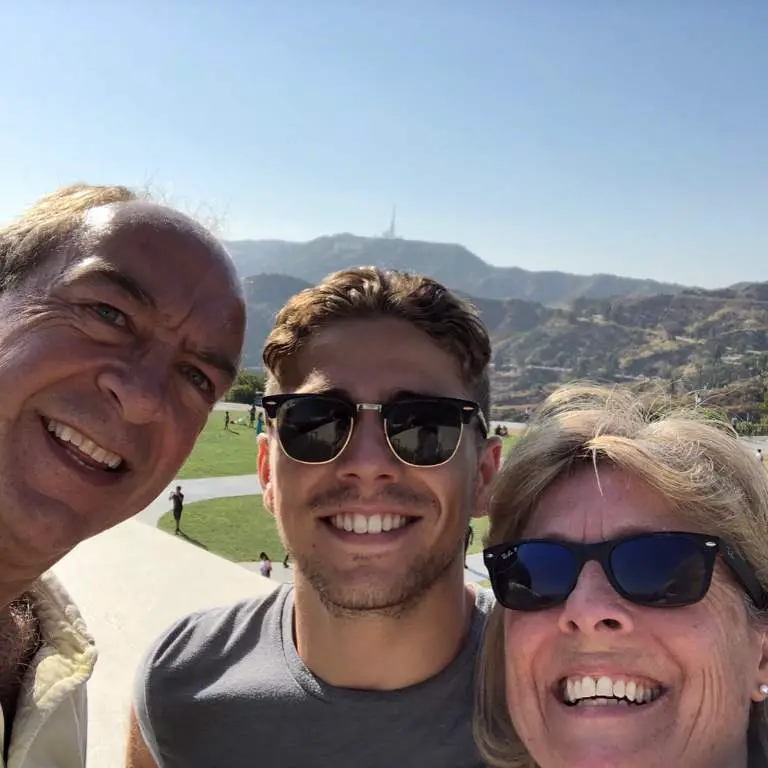 Alex Phelps taking pictures with his Stepfather and mother before his play.