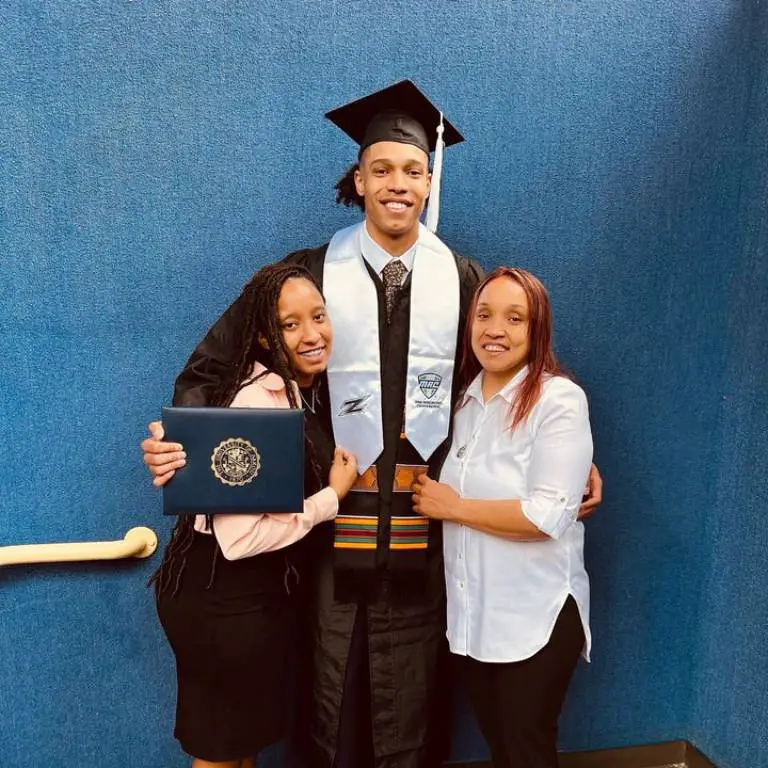 Enrique Freeman with his mother, Tania Torres and his sister, Tatiana taking a picture in his graduation