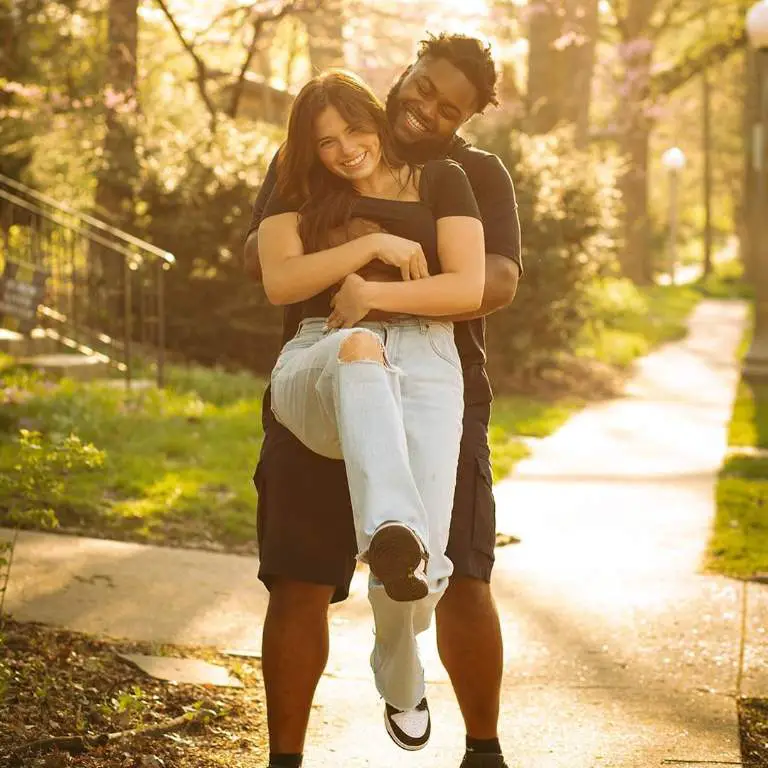 Jer'zhan Newton and his girlfriend, Ryley Huston's posing for pictures in park.