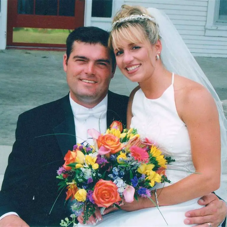 Ryley Huston's Parents posing for a picture during their wedding day