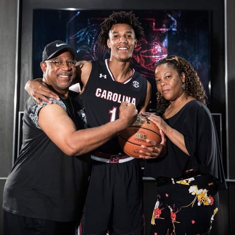 Image of AJ Lawson with his parents.