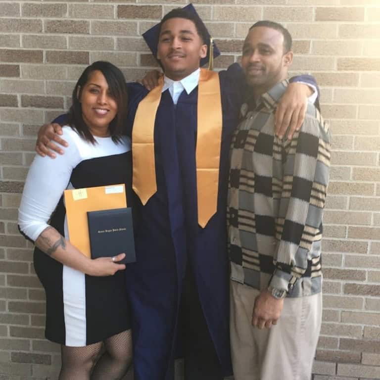 Image of Marshawn Kneeland and his parents.