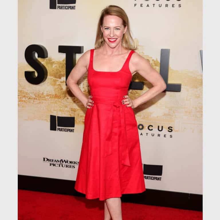 Amy Hargreaves attends an event wearing a red dress.