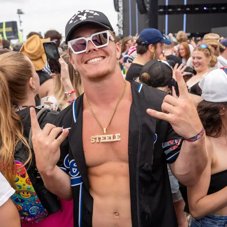 Carson wearing his chain with his surname engraved on it