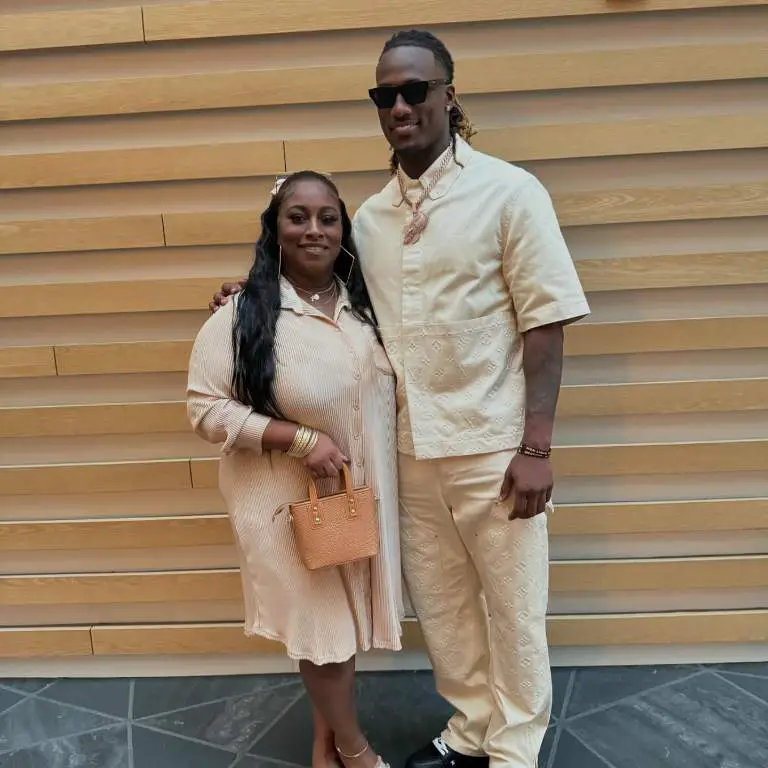 Joe Milton with his mother, Deshea Bouie wearing matching outfit for an event