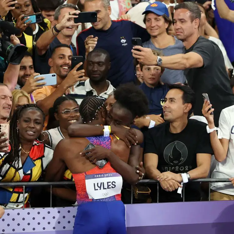 Junelle hugs her boyfriend, Noah Lyles, as he won a gold medal in 100m race in the 2024 Olympics