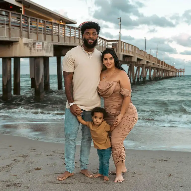 NFL player La'Mical Perine with his wife, Jennifer, and their son