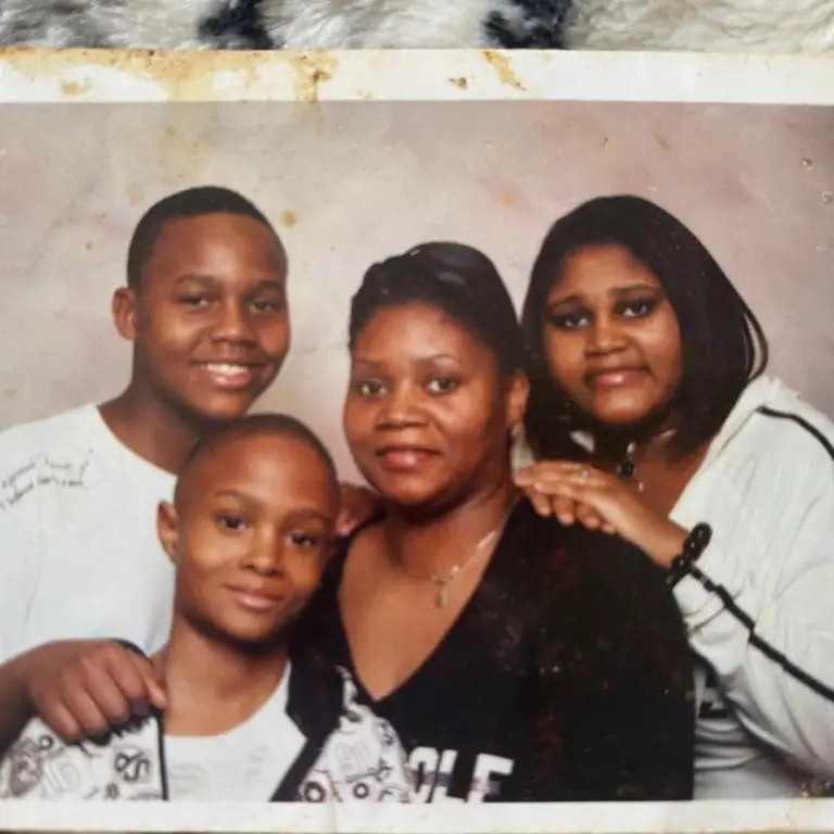 Quincy Hall with his mother and siblings