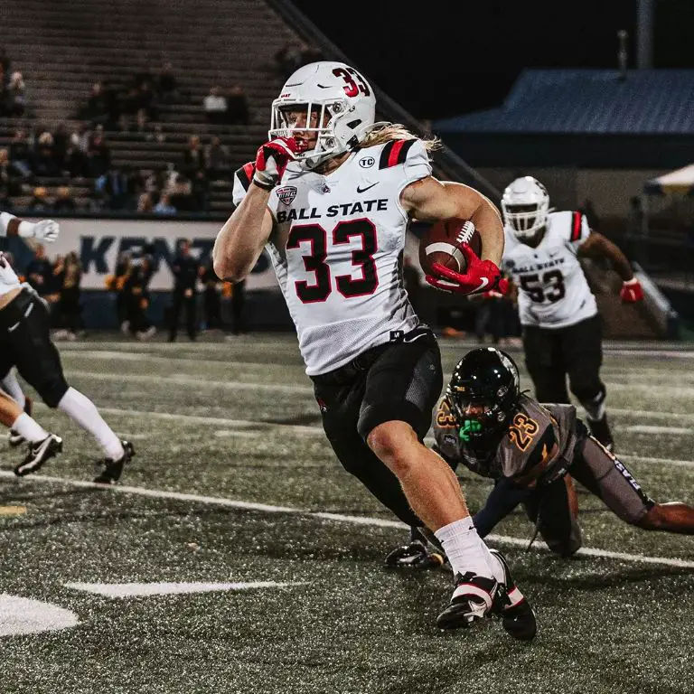 Steele while playing collegiate football at Ball State