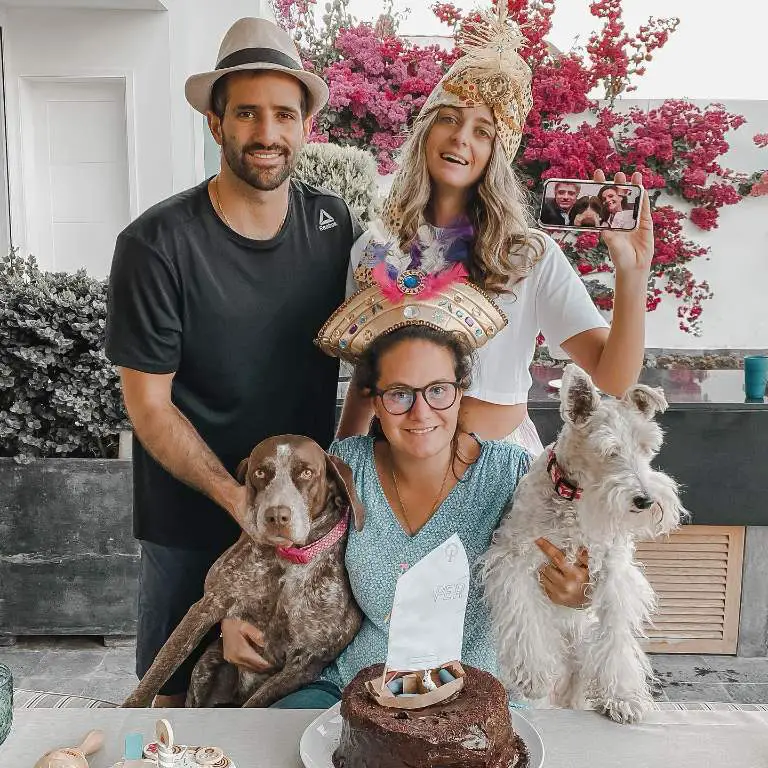 Stefano Peschiera posing for a picture with his sisters while celebrating Adriana's birthday together