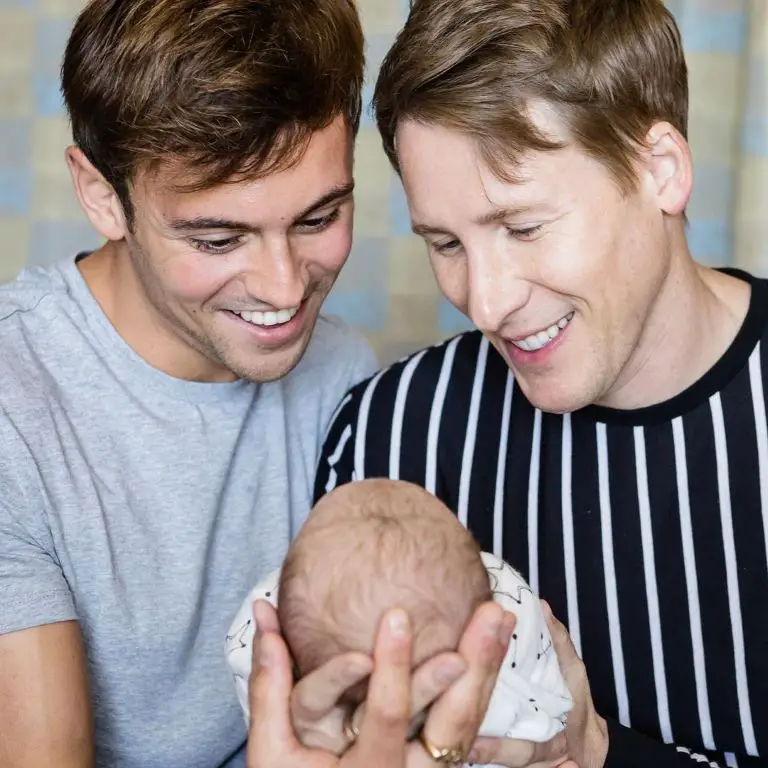 Tom Daley and Dustin Lance Black with their first kid.