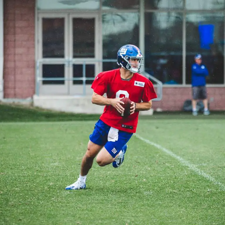 Daniel Jones practicing with his squad wearing his Giants jersey