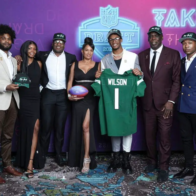 Garrett Wilson photographed with his family celebrating his selection in the team