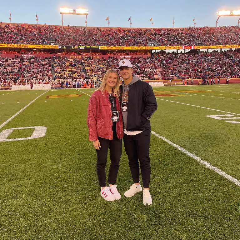 Jenna Purdy, QB Brock Purdy and his wife, Jenna, taking picture in the stadium remembering their past days.