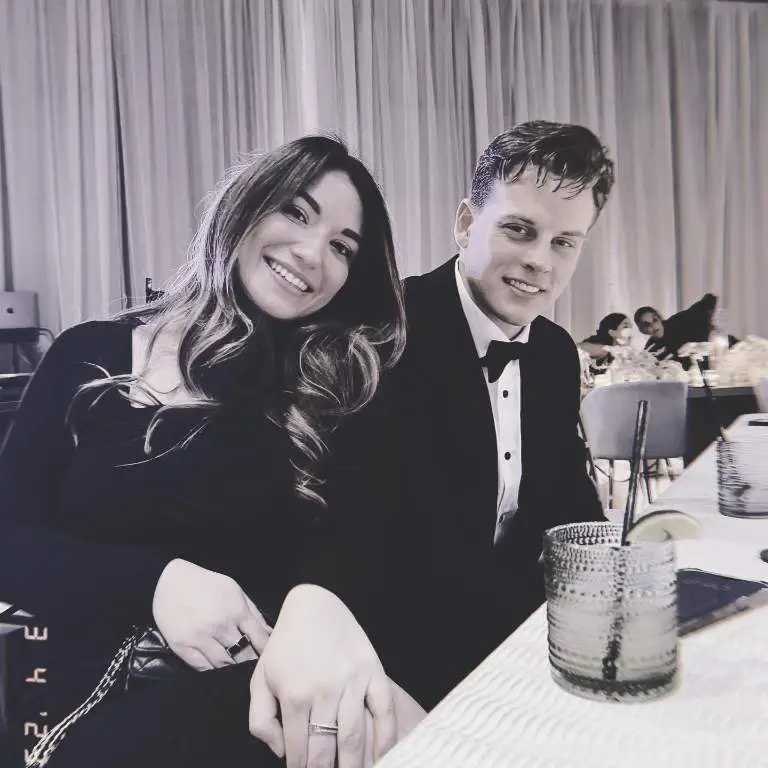 Joe Burrow and his Girlfriend, Olivia attending a friend's marriage with a matching black outfit