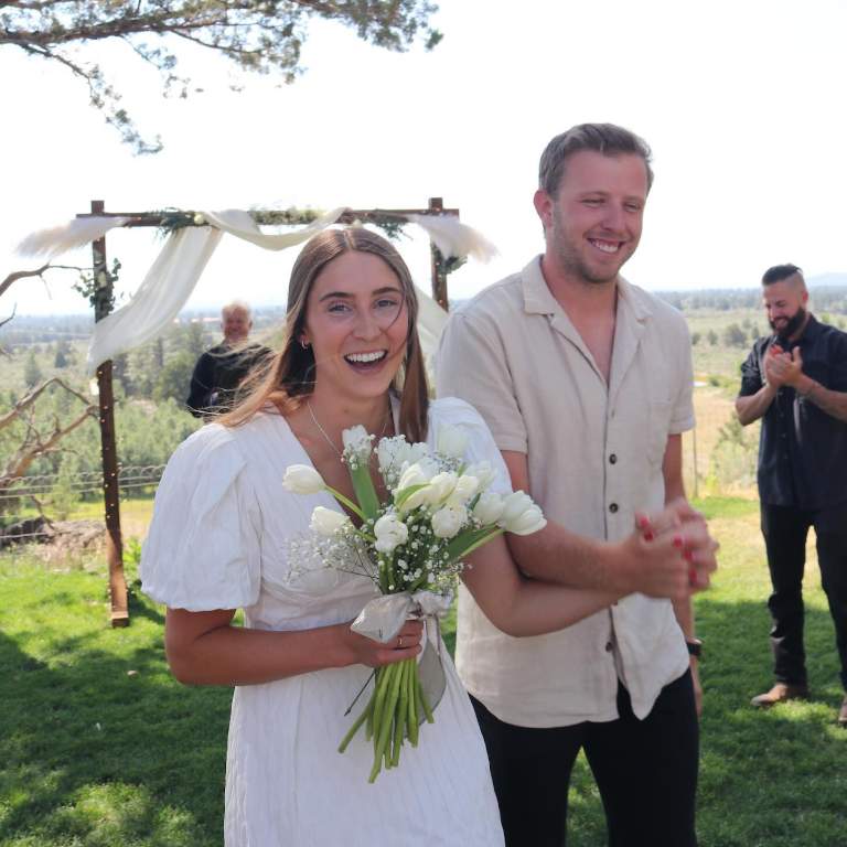 Nate Sudfeld with his Wife, Sierra Sudfeld posing for pictures on their wedding day