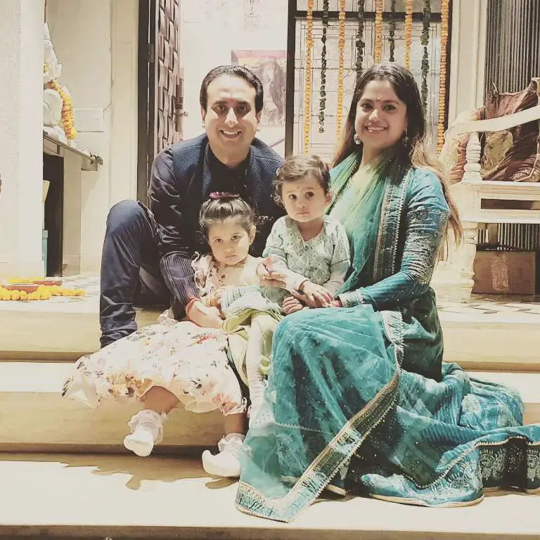 Rahul Chaudhary posing for a picture with his wife, Surabhi and children celebrating festival in their home