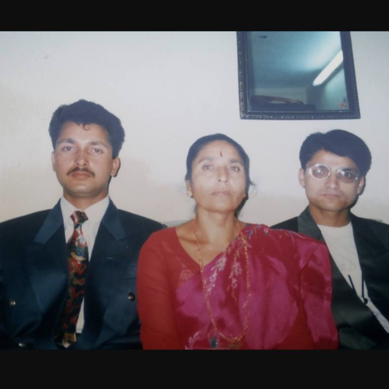 Tanka Dahal and his older brother with their mother