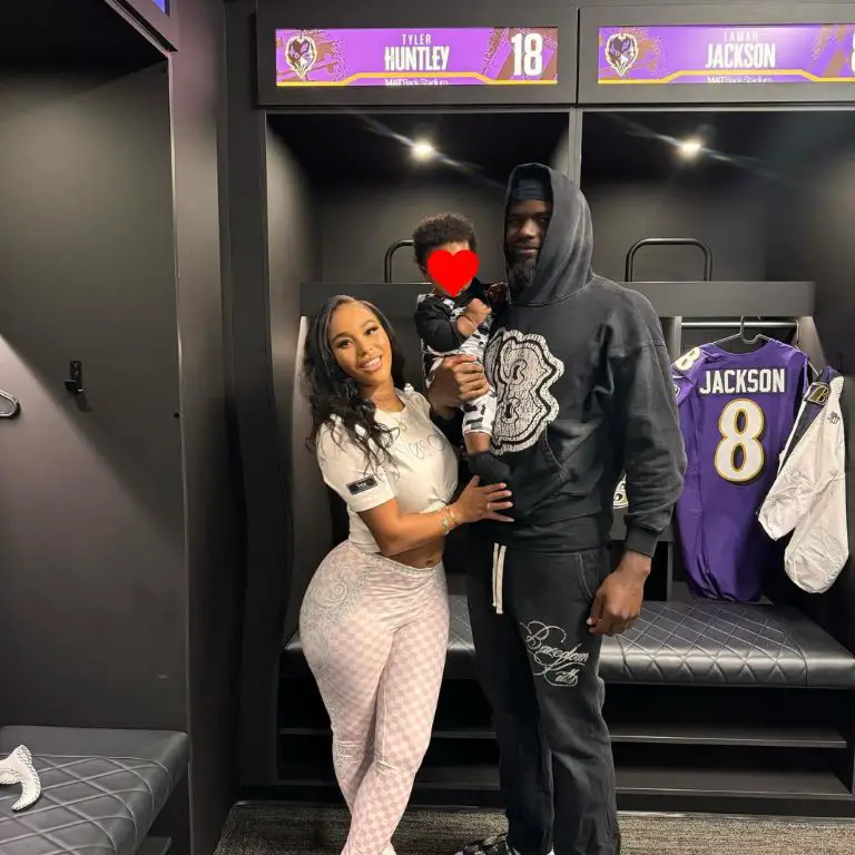 American NFL player Tyler Huntley with his son and baby mama