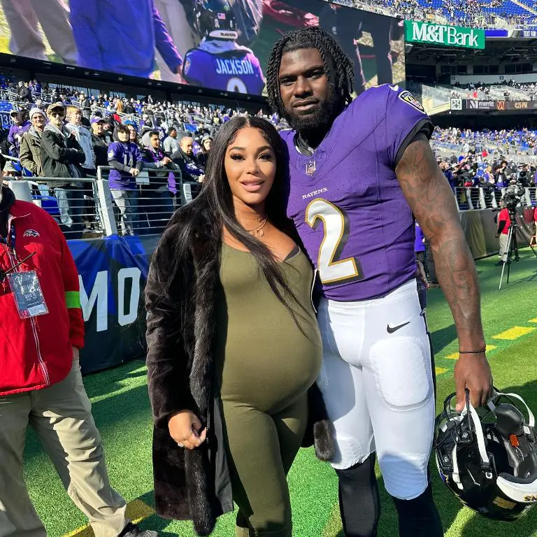 NFL QB Tyler Huntley and his girlfriend, Camille during his game