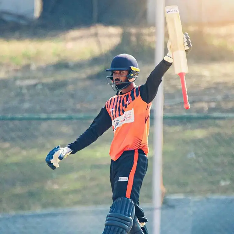 Anil Sah raises his bat.