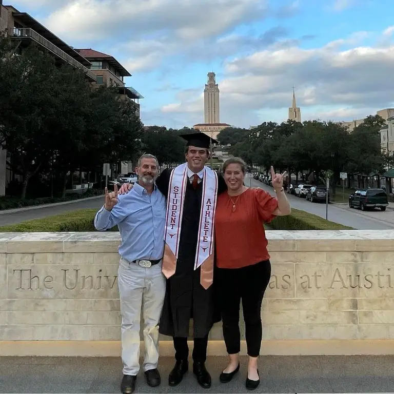 Cameron Dicker with his parents Kelly and Rachel Dicker during his graduation.