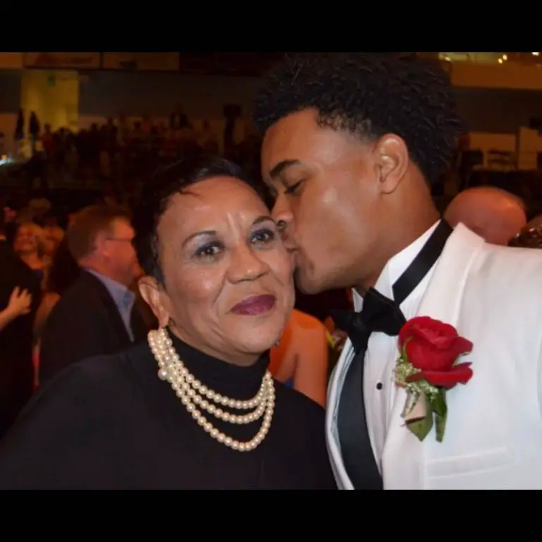 Jalen Tolbert with his mother in a function.