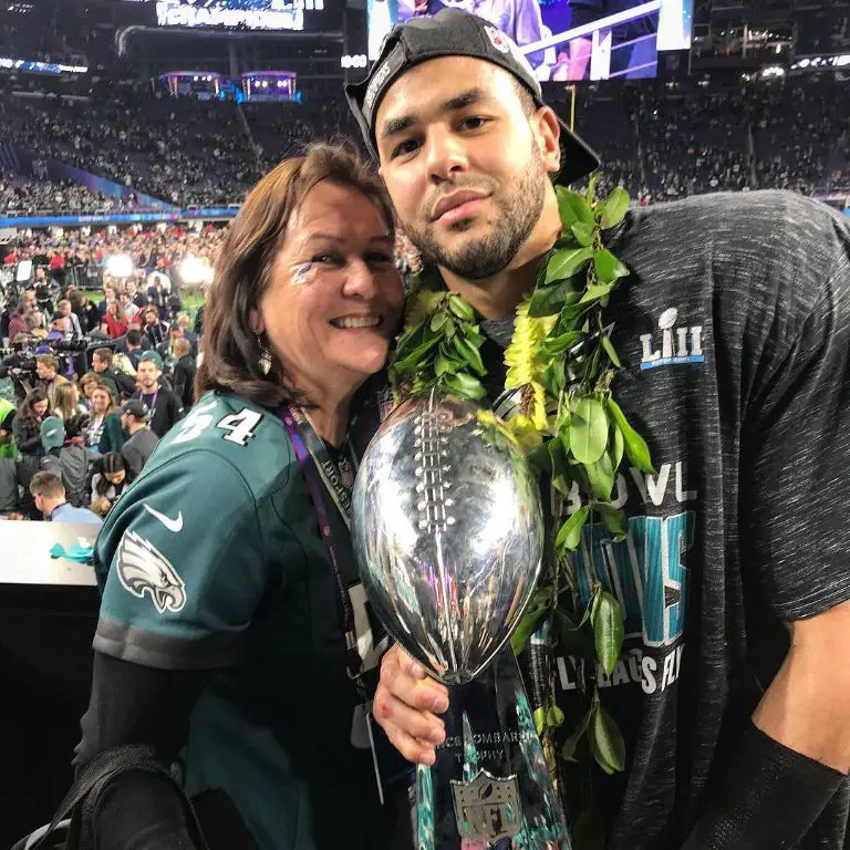 Kamu celebrating the Super bowl win with his mother, Elina Grugier-Bell.