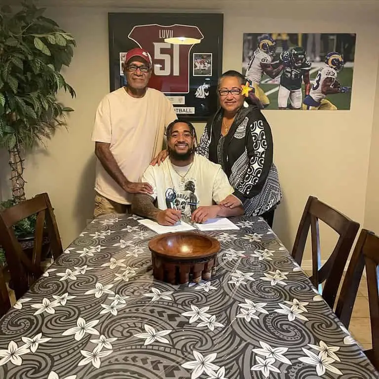 Frankie Luvu with his parents.